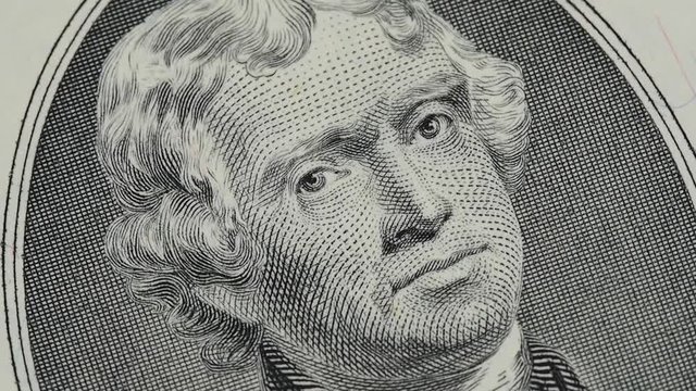 Thomas Jefferson on US 2 dollar bill close up slow rotating. United States president day background. Stock video footage