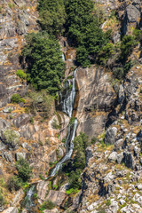View of small waterfall, slit in the Paiva river slope and water flowing through the rocks