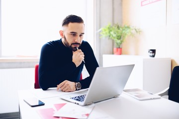 Caucasian thoughtful businessman in his office.