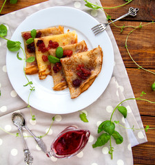 Breakfast at home Pancakes with jam and mint Vintage gray napkin