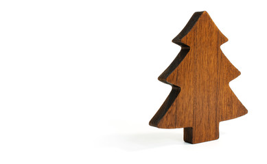 Tree shape cut out from wood as Christmas decoration with vintage look laid on white background