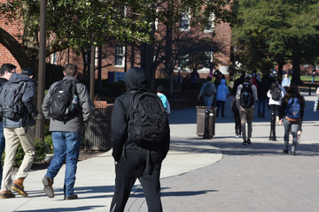 College students walk around campus on a cold winter morning