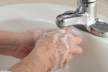 Washing hands to prevent infection and for overall health  with soap and water to prevent infection...