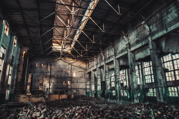 Abandoned industrial creepy warehouse inside old dark grunge factory building