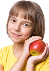Fototapeta na wymiar Attractive caucasian Girl with Apple, isolated on white background. Schoolgirl Smiling and looking at camera. Happy Child with fresh Fruit - emotional Portrait close-up.