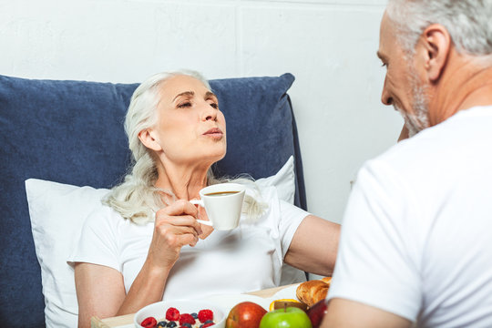woman having breakfast in the bed