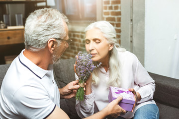 woman smelling bouquet of lavender