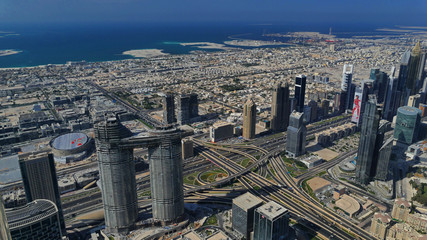Naklejka na ściany i meble Cityscape of Dubai city centre with skyscrapers and sea, United Arab Emirates