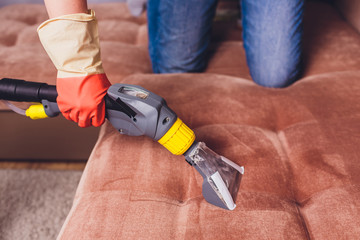 Sofa chemical cleaning with extraction method. Early spring cleaning or regular clean up. Dry...