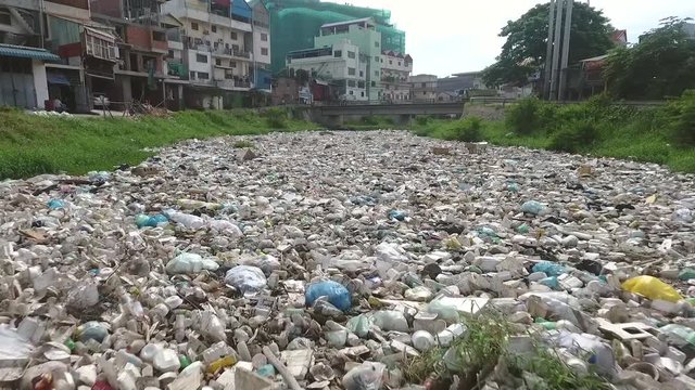 Aerial view of river with a high concentration of trash, Cambodia.