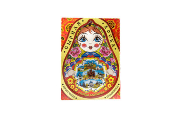 ceramic souvenir toy in form of matryoshka with color painting on isolated white background reflecting the national Russian culture with the inscription in Russian: Ceramic cheese board Russian beauty