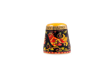 ceramic souvenir toy in the form of thimble with beautiful color painting on isolated white background reflecting the national Russian culture with the inscription in Russian: "that I give"