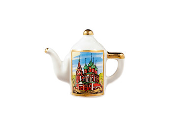 ceramic souvenir toy in the form of kettle with color painting on isolated white background reflecting the national Russian culture with the inscription in Russian: the name of the city of Yaroslavl