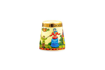 Fototapeta na wymiar ceramic souvenir toy in the form of thimble with beautiful color painting on isolated white background reflecting the national Russian culture with the inscription in Russian: 
