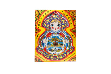 ceramic souvenir toy in the form of matryoshka with beautiful color painting on isolated white background reflecting the national Russian culture with the inscription in Russian: Ceramic cheese board