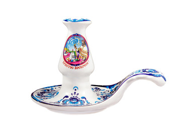 ceramic souvenir toy in the form of candlestick with beautiful color painting on isolated white background reflecting the national Russian culture with the inscription in Russian: Christ Is Risen!