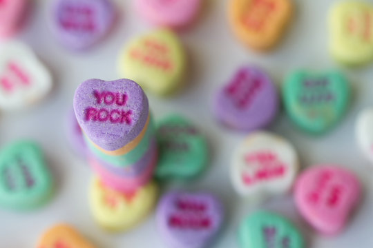 Valentine photograph of multicolored candy hearts with a You Rock standout