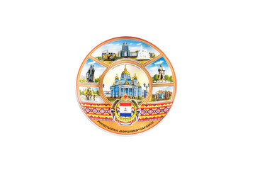ceramic souvenir toy in form of plate with painting on isolated white background reflecting the national Russian culture with the inscription in Russian: The Republic of Mordovia the city of Saransk