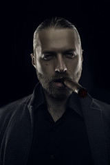 Badass character man with cigar on black, shallow depth of field