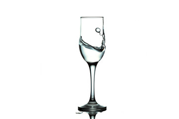 water splash and wine glass. splash alcohol in wine glass