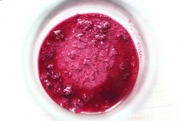 precipitate of raspberry jam in a jar/jam in a jar isolated on white