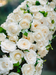 Floral decoration for wedding arch with white flowers.
