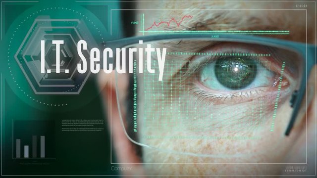 A close up of a businessman eye controlling a futuristic computer system with a Business IT Security concept.