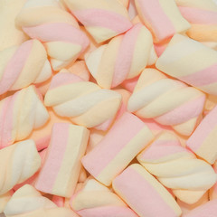 Marshmallows. Marshmallows background texture. Colored twisted marshmallow 