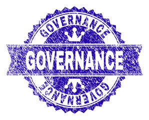 GOVERNANCE rosette stamp imitation with grunge texture. Designed with round rosette, ribbon and small crowns. Blue vector rubber print of GOVERNANCE text with grunge texture.
