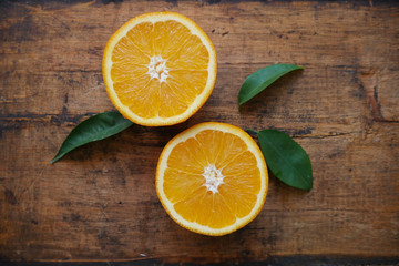 Fototapeta na wymiar orange slices on wooden background