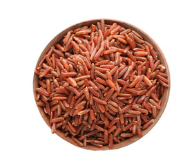 Wooden bowl with brown rice on white background, top view