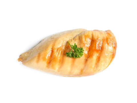 Grilled chicken breast with parsley on white background, top view