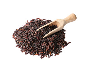Scoop and uncooked black rice on white background