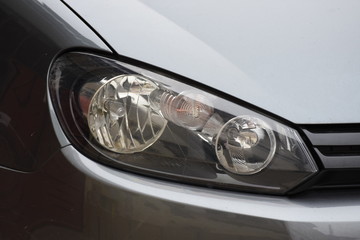 shiny headlights on a new car