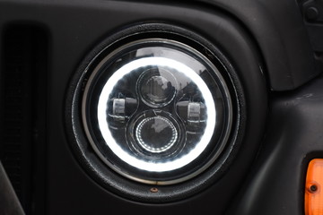 shiny headlights on a white car