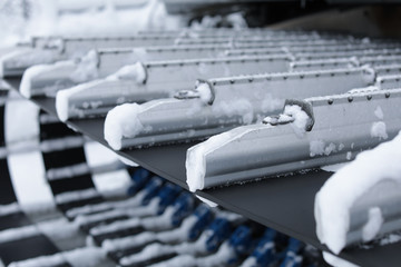 Closeup view of snow removal machine track