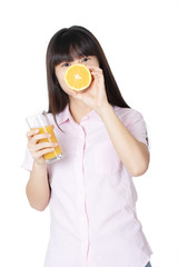 Chinese woman drinking orange juice isolated on white background