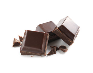 Pieces of tasty dark chocolate on white background