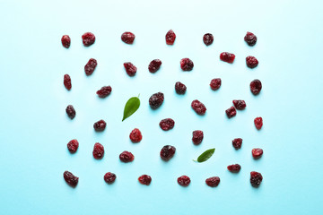 Flat lay composition of cranberries on color background. Dried fruit as healthy snack