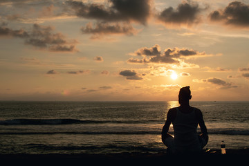 Young man silhouette enjoying sunset