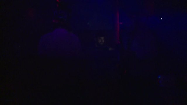 People dance in the club to the music. Playing saxophone and music dance