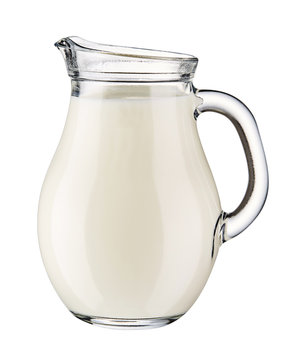Glass jug of fresh milk isolated on white background. 