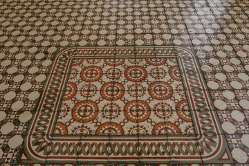 Ancient tiled floor with mosaic pattern.