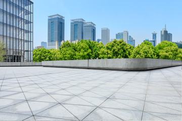 Fototapeta premium City square floor and modern commercial building in Shanghai