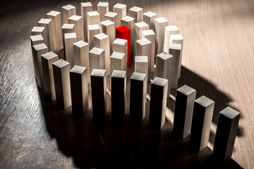 Risk and strategy in business, a lot of wooden blocks with red in the middle