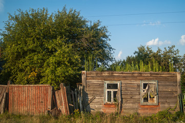 Ruined wooden  house in the Ukrainian village