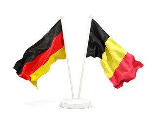 Two waving flags of Germany and belgium
