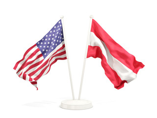Two waving flags of United States and austria