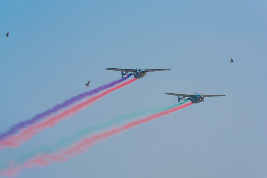 Army Show Performant Air Craft And Colorful Smoke In Air Show With Blue Cloud Sky Background.