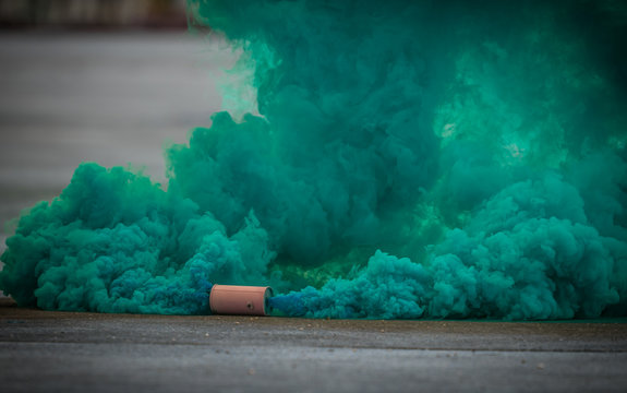 Colorful Green Smoke Bombs Action In Showing